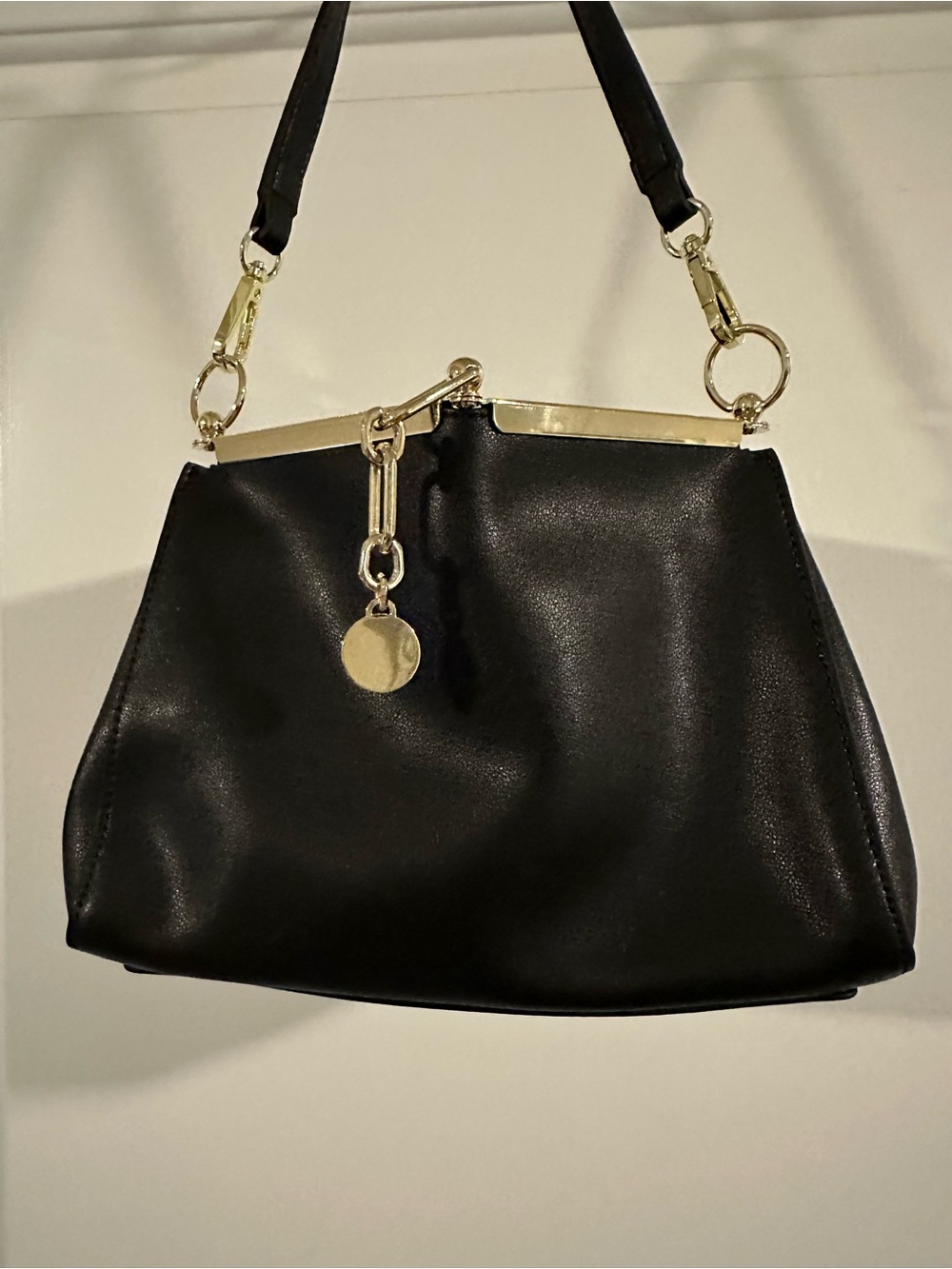 Black Leather Shoulder Bag with Gold Accents